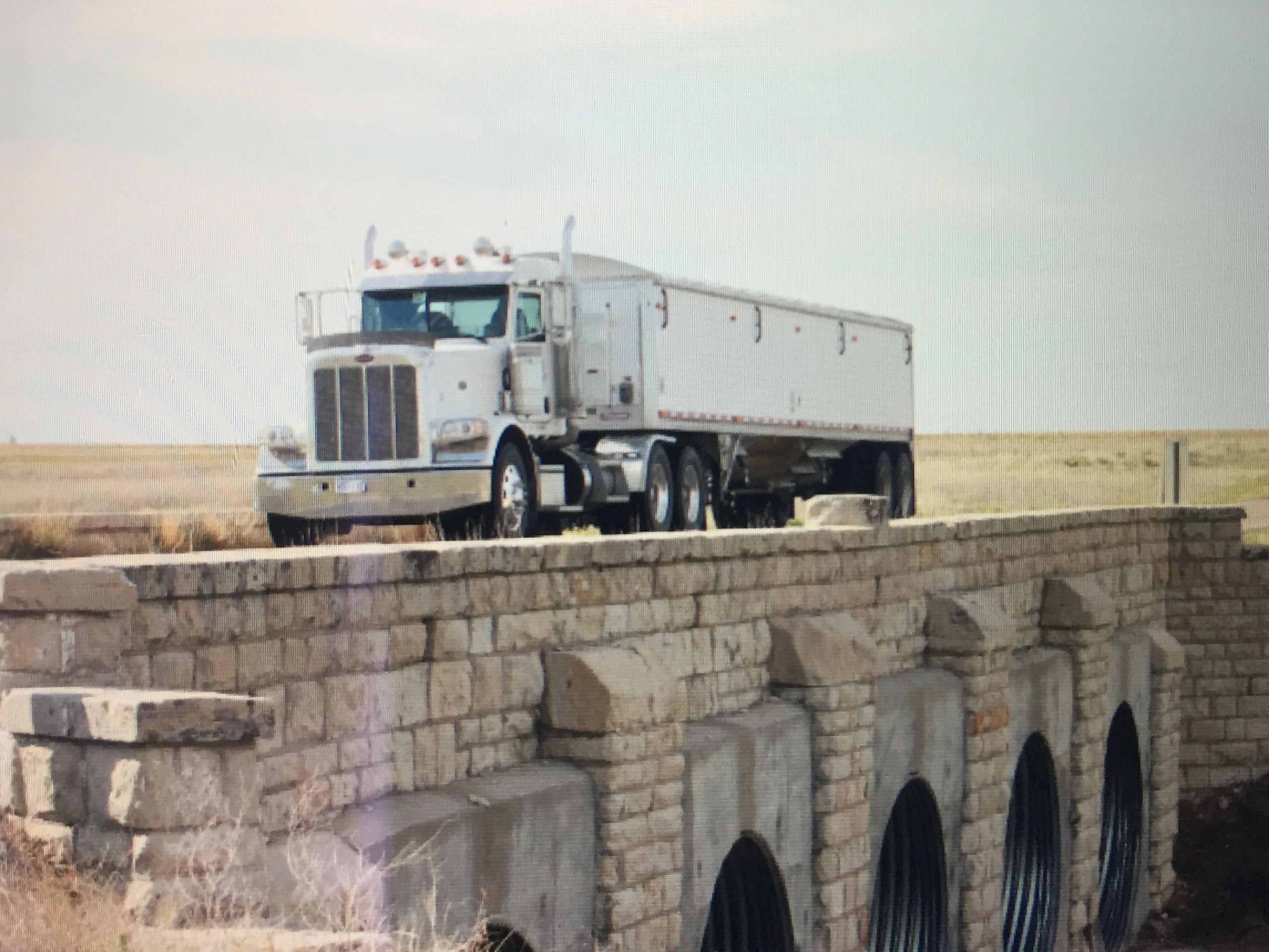 Southwest Family Farms semi truck on bridge